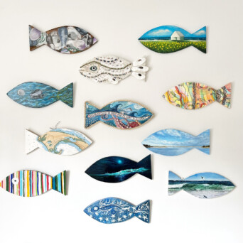 A wall of beautiful fish artwork from Cottage