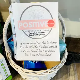 A "take what you need" basket of menstrual products from Pure Vita Modern Apothecary