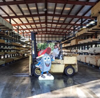 Mid Cape Home Centers warehouse with tractor and employee