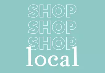 A teal slide with the white words "shop shop shop local"