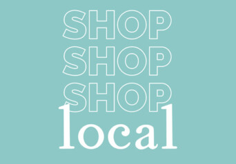 A teal slide with the white words "shop shop shop local"