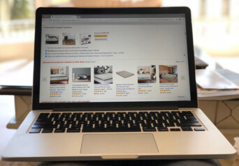 An open laptop with online shopping platform on the screen